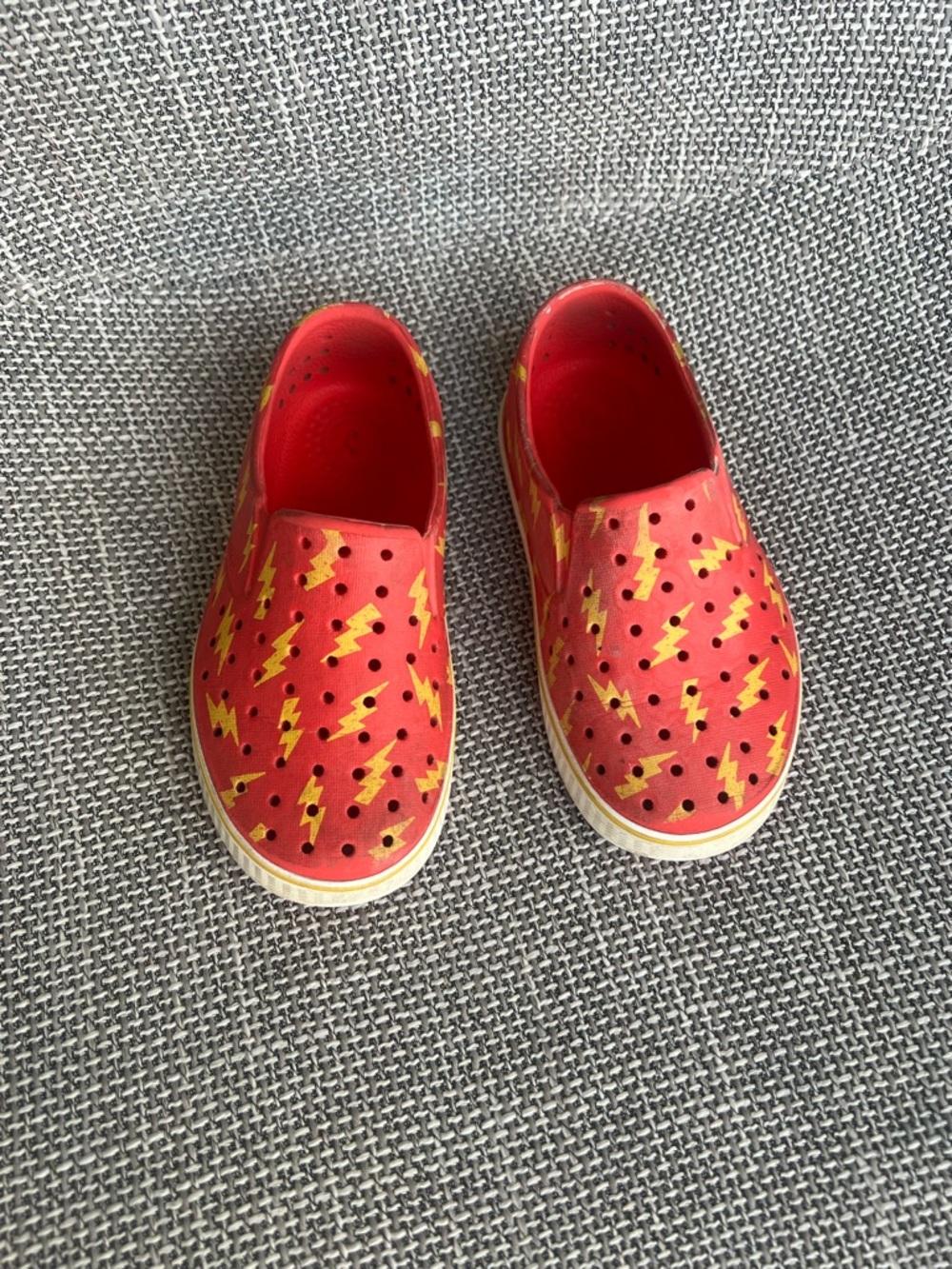 Native Sugar Lite Kids Red Slip-On Sneakers with Yellow Lightning Pattern